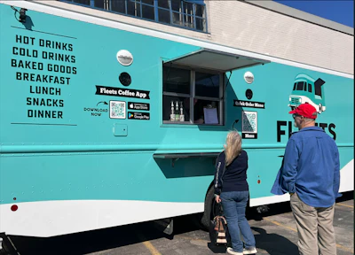 Fleets Coffee food truck with customers ordering at service window