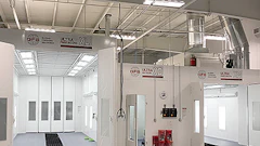 Industrial automotive paint and body shop with white spray painting booths