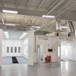 Industrial automotive paint and body shop with white spray painting booths