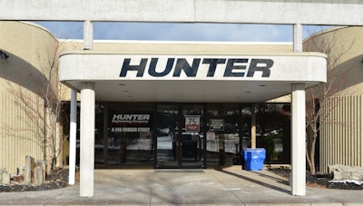 Hunter Engineering Company entrance with modern storefront and white architectural columns