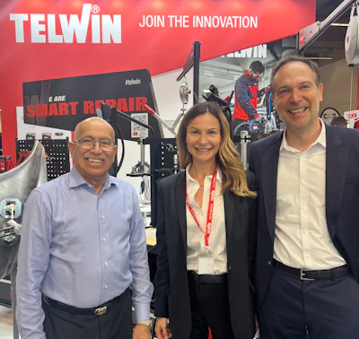 Telwin trade show booth with three smiling professionals showcasing Smart Repair technology