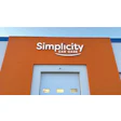 Simplicity Car Care facility with orange exterior and blue garage door