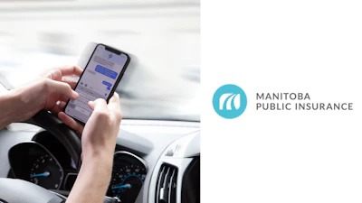 Distracted driving warning: Hand texting on smartphone while driving dashboard visible