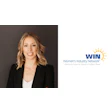 Professional woman in black blazer representing Women's Industry Network