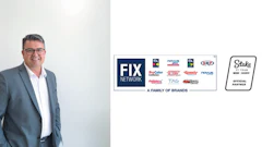 FIX Network executive in gray suit with automotive service brands display