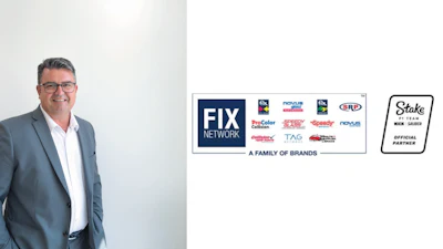FIX Network executive in gray suit with automotive service brands display