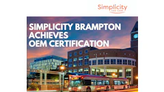 Brampton city bus at night with municipal building and sunset sky, Simplicity Car Care logo