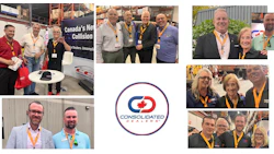 Consolidated Dealers team members networking at industry conference in warehouse environment