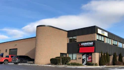 CARSTAR auto body repair shop with brick exterior and red logo