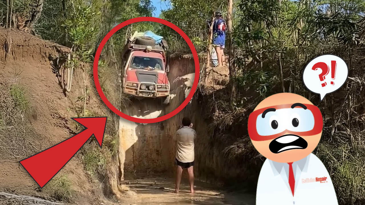 Off-road vehicle navigating dangerous narrow dirt channel with steep walls