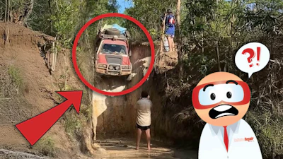 Off-road vehicle navigating dangerous narrow dirt channel with steep walls