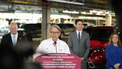 Honda EV manufacturing press conference with government officials in automotive plant