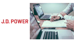 Business professionals collaborating with laptops and documents at a workspace