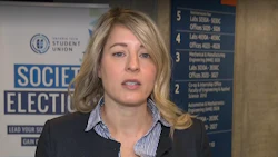 Student election representative speaking at university building directory