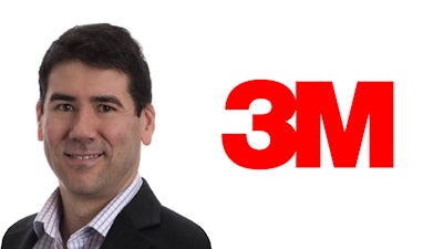 3M corporate professional in business attire with company logo