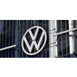 Volkswagen logo on sleek corporate headquarters building exterior