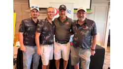 XGC team of four professionals posing together at corporate event