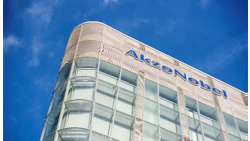 AkzoNobel corporate headquarters with blue logo on modern glass building