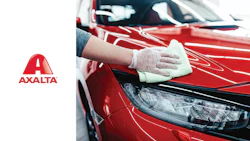 Professional car detailing: red vehicle surface polished with microfiber cloth