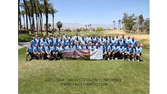 Craftsman Collision team group photo at Desert Falls Country Club with mountain landscape