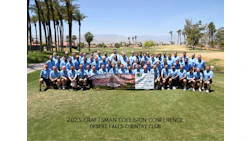 Craftsman Collision team group photo at Desert Falls Country Club with mountain landscape