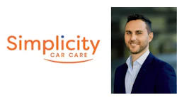 Simplicity Car Care professional in navy blazer with company logo