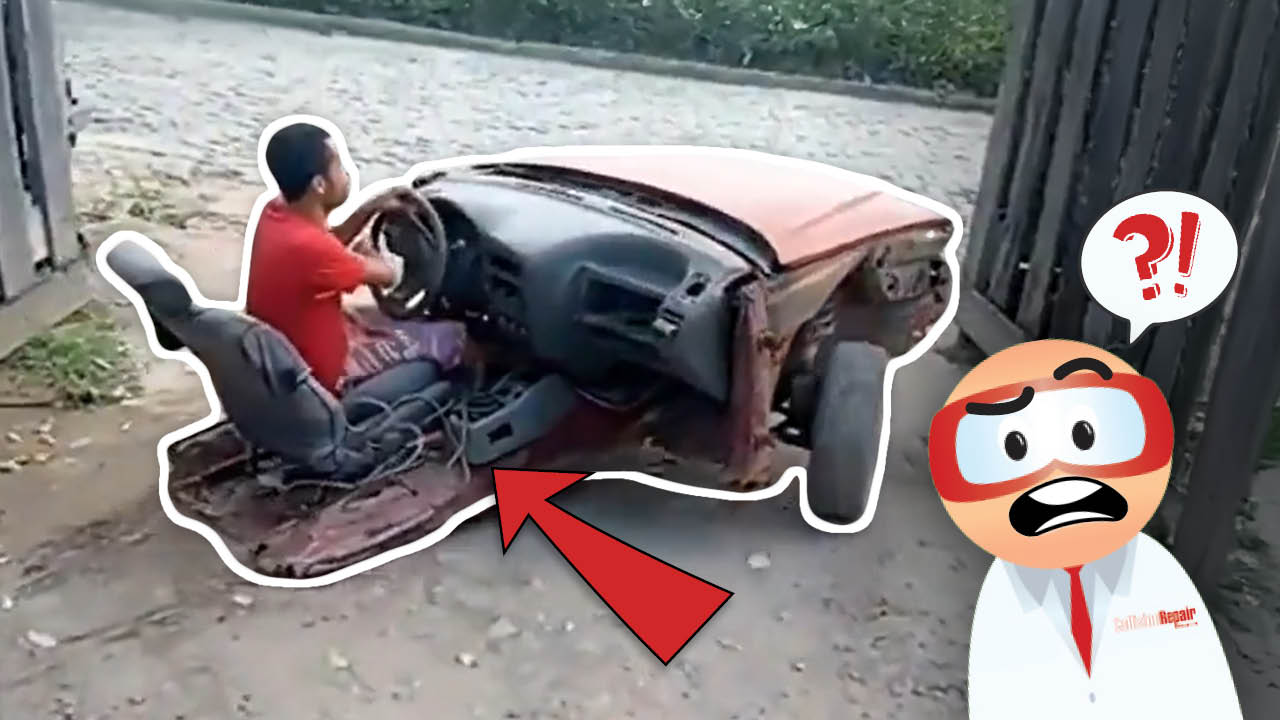 Bizarre car scene: Person sitting in stripped vehicle chassis with cartoon emoji reaction