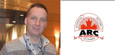 Professional at automotive conference with ARC Canada organizational logo