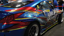 Zestino racing car with blue and red livery at automotive exhibition