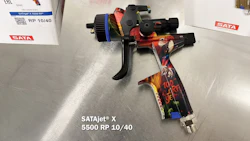 SATA professional spray gun with colorful artistic design on metallic background