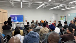 Diverse group attending a professional workshop or training session in a modern conference room