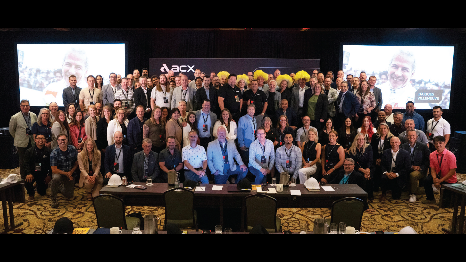 Large group of professionals gathered for BCX corporate conference or meeting