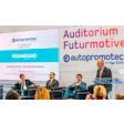 Autoprometec conference panel discussion at Futurmotive event with speakers on stage