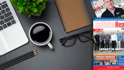 Workspace desk with laptop, coffee, magazine, and office accessories