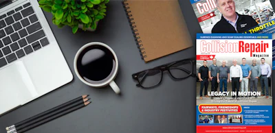 Workspace desk with laptop, coffee, magazine, and office accessories