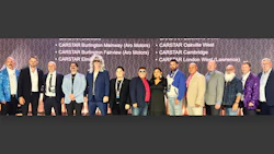 Group of diverse professionals posing at CARSTAR automotive conference event