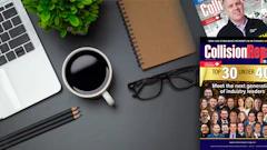Workspace desk with laptop, coffee, magazine featuring Top 30 Under 40 industry leaders