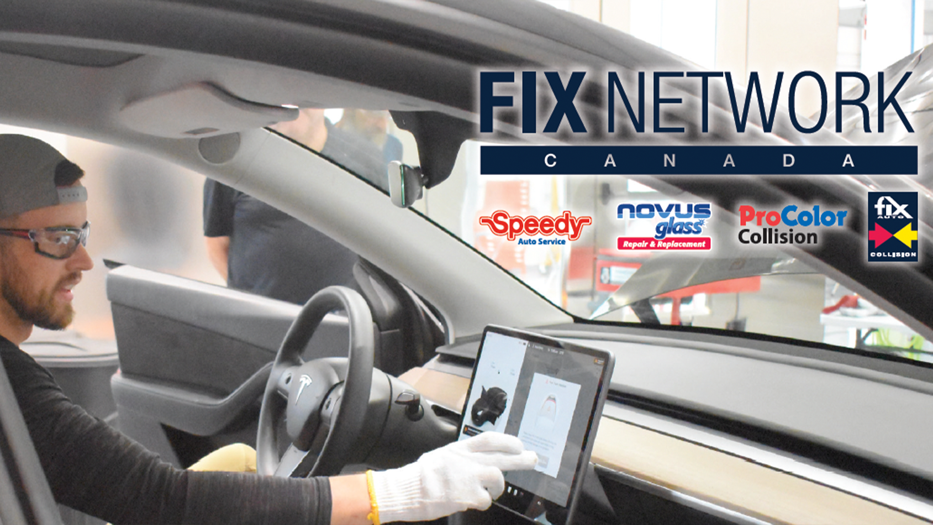 Automotive technician using tablet inside vehicle at Fix Network Canada repair shop