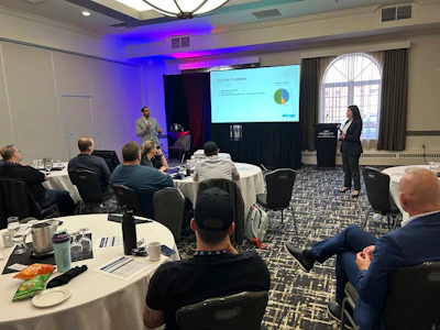 Business conference with presenter sharing data visualization on screen