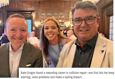 Three professionals smiling together at an indoor event