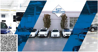 White and blue auto collision repair shop with several parked vehicles
