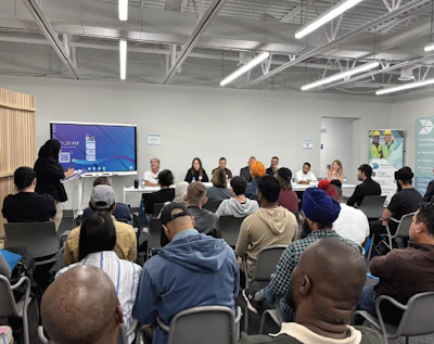 Diverse group attending professional training session in modern conference room