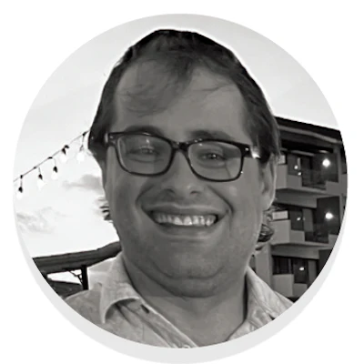 Smiling man with glasses in black and white profile photo