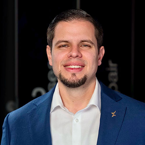 Smiling professional in blue suit jacket with white shirt