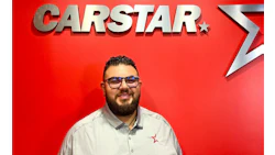 CARSTAR automotive service logo with employee in white shirt