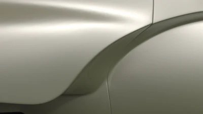 Curved metallic surface with soft light and shadow gradient