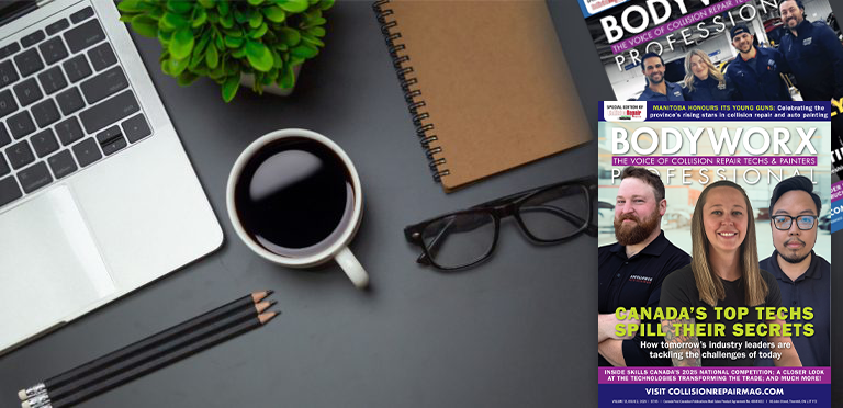 Desktop workspace with laptop, coffee, magazine, plant, and glasses