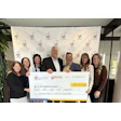 Group presenting large donation check for Ronald McDonald House Charities
