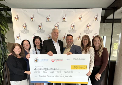 Group presenting large donation check for Ronald McDonald House Charities