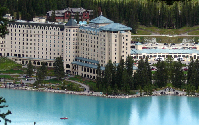Fairmont Chateau Lake Louise in Banff National Park, with turquoise lake and mountain forest backdrop